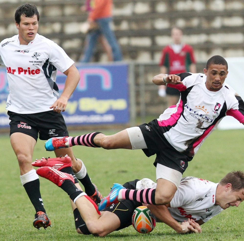 Dynamic scene of rugby players in action, showcasing skill and teamwork on the field.